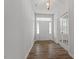Light-filled foyer featuring hardwood floors and a classic chandelier at 3008 Dog Rose Dr # 307, Durham, NC 27703
