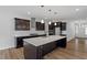 Modern kitchen featuring a large island, stainless steel appliances, and stylish cabinetry at 3008 Dog Rose Dr # 307, Durham, NC 27703