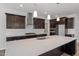 Kitchen featuring granite counters, stainless appliances, dark wood cabinets and island sink at 3008 Dog Rose Dr # 307, Durham, NC 27703