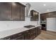 Modern kitchen highlighting stainless steel range hood and cooktop with white subway tile backsplash at 3008 Dog Rose Dr # 307, Durham, NC 27703