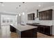 Elegant kitchen featuring a large island, stainless steel range hood, and recessed lighting at 3008 Dog Rose Dr # 307, Durham, NC 27703