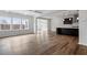 Open-concept living area features abundant natural light and hardwood floors that seamlessly connect to the modern kitchen at 3008 Dog Rose Dr # 307, Durham, NC 27703