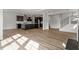 Inviting open-concept living space with kitchen island, staircase, and modern finishes at 3008 Dog Rose Dr # 307, Durham, NC 27703