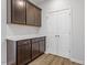 Butler's pantry with ample cabinet space and quartz countertop adjacent to white double door at 3008 Dog Rose Dr # 307, Durham, NC 27703