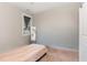 Neutral bedroom with bed, mirror, and natural light at 303 Godwin St, Selma, NC 27576