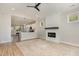 Spacious living room featuring high ceiling, fireplace and open to the kitchen at 303 Godwin St, Selma, NC 27576