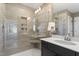 Well-lit bathroom featuring a glass-enclosed shower, tile surround, and sleek vanity with storage space at 327 Augusta Pond Way # 172, Raleigh, NC 27603