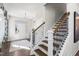 Welcoming entryway with a staircase featuring wooden treads, and black iron spindles at 327 Augusta Pond Way # 172, Raleigh, NC 27603