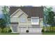 Charming two-story home with a gray roof, dual garage, and a neatly manicured lawn at 327 Augusta Pond Way # 172, Raleigh, NC 27603