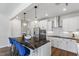 Well-equipped kitchen with stainless steel appliances, white cabinets, and bar-style seating at 327 Augusta Pond Way # 172, Raleigh, NC 27603