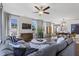 Spacious living room with large windows, modern decor, and comfortable seating at 327 Augusta Pond Way # 172, Raleigh, NC 27603