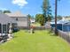 Fenced backyard featuring a well-maintained lawn and a playset, great for outdoor activities at 3413 S Beaver Ln, Raleigh, NC 27604