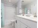 Bright bathroom with a combination tub and shower, double vanity with black hardware, and neutral tile at 3413 S Beaver Ln, Raleigh, NC 27604