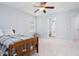 Bedroom with neutral carpet, a twin bed, a ceiling fan, and a connected bathroom at 3413 S Beaver Ln, Raleigh, NC 27604