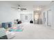 Spacious bonus room with neutral carpeting, a ceiling fan, and plenty of natural light at 3413 S Beaver Ln, Raleigh, NC 27604