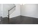Inviting entryway with hardwood floors, staircase, and modern lighting creates a welcoming ambiance at 3413 S Beaver Ln, Raleigh, NC 27604