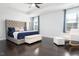 Serene main bedroom with a large bed, sitting area, and bright windows offering plenty of light at 3413 S Beaver Ln, Raleigh, NC 27604