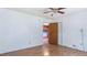 View of the bedroom with neutral colors and a glimpse into the kitchen at 3899 Warrenton Rd, Henderson, NC 27537