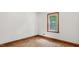 A sunlit bedroom features wood floors and a large window at 3899 Warrenton Rd, Henderson, NC 27537