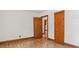 Bedroom with wood floors and door to another room at 3899 Warrenton Rd, Henderson, NC 27537