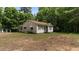 View of the exterior featuring a yard and traditional design giving a glimpse of outdoor living at 3899 Warrenton Rd, Henderson, NC 27537