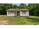 Charming single-story home with a welcoming front porch and well-maintained lawn and traditional design at 3899 Warrenton Rd, Henderson, NC 27537