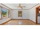 Spacious living area with hardwood floors, neutral walls, and large windows allowing ample light to fill the room at 3899 Warrenton Rd, Henderson, NC 27537