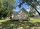Large backyard with wooden deck, perfect for outdoor entertaining and relaxation at 409 S Flanner St St, Burlington, NC 27215