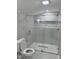 Modern bathroom featuring a glass-enclosed shower with marble-like tile and built-in shelving at 409 S Flanner St St, Burlington, NC 27215