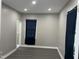 Bedroom with recessed lighting, windows with curtains, and a view into the bathroom at 409 S Flanner St St, Burlington, NC 27215