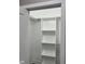 Organized closet space with built-in shelves and a hanging rod at 409 S Flanner St St, Burlington, NC 27215