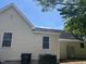 Exterior view of home showing modern siding, roof, and HVAC system at 409 S Flanner St St, Burlington, NC 27215
