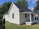 Charming home featuring modern siding, windows, and welcoming front porch at 409 S Flanner St St, Burlington, NC 27215