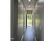Hallway featuring hardwood floors and recessed lighting that leads to a back deck and backyard at 409 S Flanner St St, Burlington, NC 27215