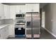 Kitchen features modern stainless steel appliances, including a microwave, oven, and refrigerator at 409 S Flanner St St, Burlington, NC 27215