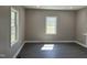 Sun-filled living room with windows and luxury vinyl plank flooring at 409 S Flanner St St, Burlington, NC 27215