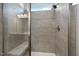 Modern bathroom featuring a tiled shower with a built-in bench and sleek fixtures at 48 Spirit Springs Rd, Smithfield, NC 27577