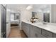 Bathroom with a double vanity, sleek countertops, and easy access to a glass shower and the main bedroom at 48 Spirit Springs Rd, Smithfield, NC 27577