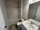 Clean bathroom featuring a shower-tub combo, a vanity, and a sink at 48 Spirit Springs Rd, Smithfield, NC 27577
