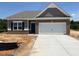 New construction home with a brick facade and a two-car garage, offering modern living at 48 Spirit Springs Rd, Smithfield, NC 27577