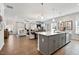 Open-concept kitchen with modern island, stainless steel appliances, and seamless flow to living area at 48 Spirit Springs Rd, Smithfield, NC 27577