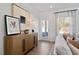 Bright living room featuring stylish decor, wood floors, and a doorway leading to the outdoor space at 48 Spirit Springs Rd, Smithfield, NC 27577