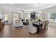 Open-concept living space boasts lots of light and an adjacent dining area great for entertaining at 48 Spirit Springs Rd, Smithfield, NC 27577