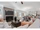 Open-concept living area with a cozy fireplace and views of the dining area and modern kitchen at 48 Spirit Springs Rd, Smithfield, NC 27577