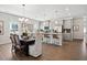 Open-concept living space boasts lots of light and features an adjacent dining area and modern kitchen at 48 Spirit Springs Rd, Smithfield, NC 27577