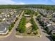Scenic aerial view of a Gathering-friendly neighborhood featuring tree-lined streets and a central park at 49 Salt Cedar Ln, Chapel Hill, NC 27516