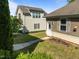 Backyard view of the home and lawn at 49 Salt Cedar Ln, Chapel Hill, NC 27516