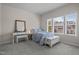 Cozy bedroom with a vanity and a window letting in natural light at 49 Salt Cedar Ln, Chapel Hill, NC 27516