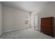 Bedroom with carpet, a window for natural light and entry to the Primary bath at 49 Salt Cedar Ln, Chapel Hill, NC 27516