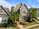 Attractive home featuring mixed siding, a well-maintained lawn, and a pathway leading to the front door at 49 Salt Cedar Ln, Chapel Hill, NC 27516